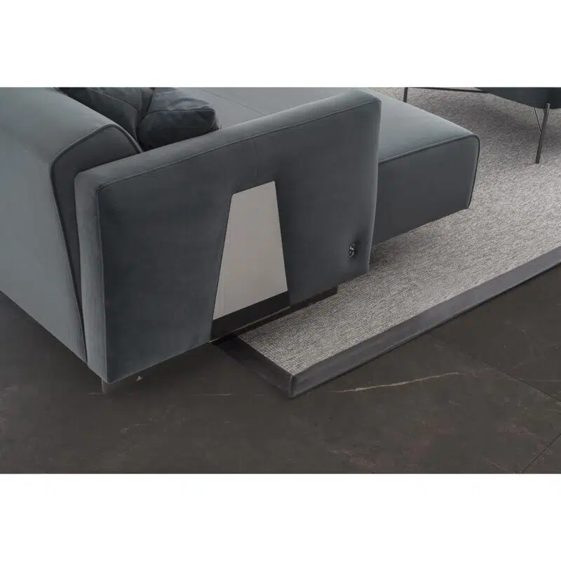 Modern sectional sofa detail on gray rug, luxury design from LEOPARD Furniture Canada.