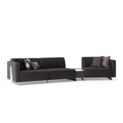 heritage modular sofa in black leather tufted with coffee table between the modules