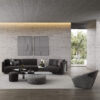black leather high end luxury modular sofa with inter coffee table and a contemporary unique design accent chair