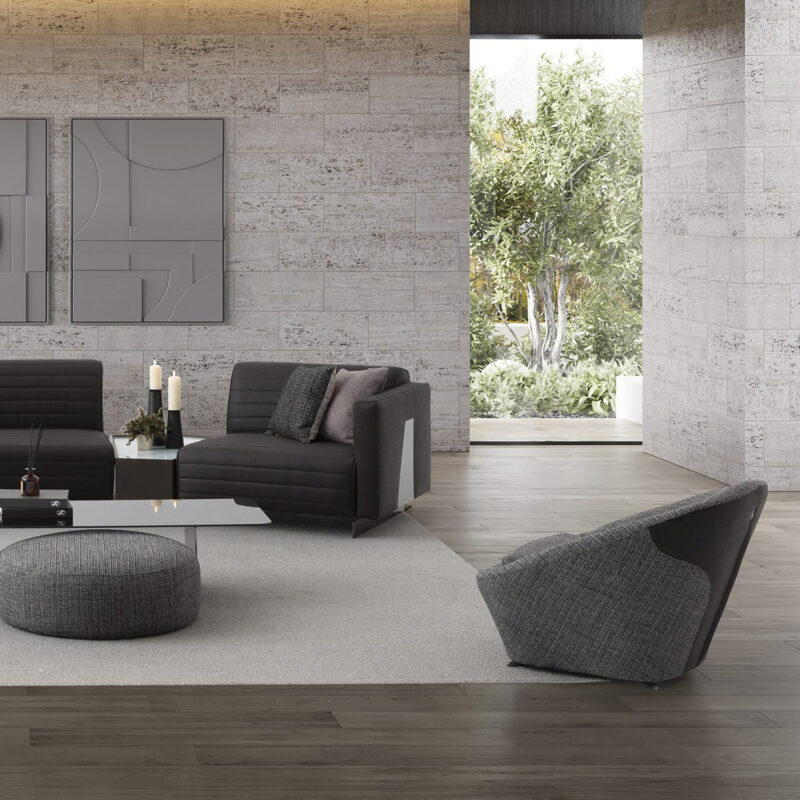 black leather high end luxury modular sofa with inter coffee table and a contemporary unique design accent chair