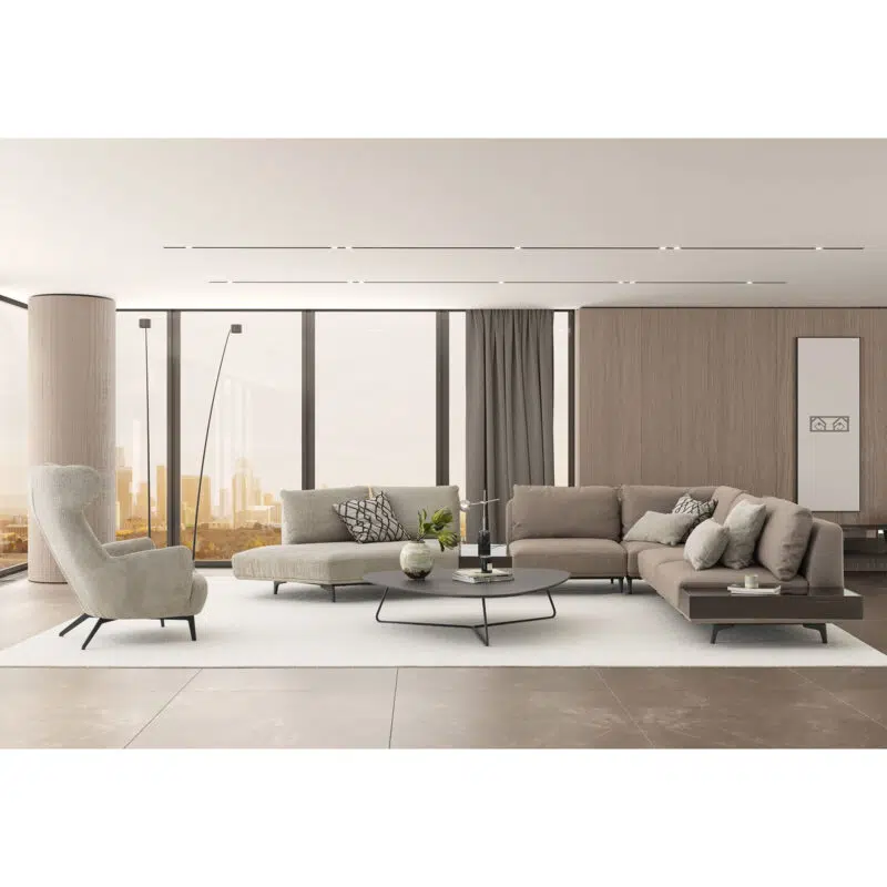 The Loft Modular Sofa in a modern living space with a off white rug and a minimalist coffee table