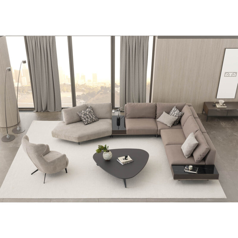 The Loft Modular Sofa in a modern living space with a off white rug and a minimalist coffee table