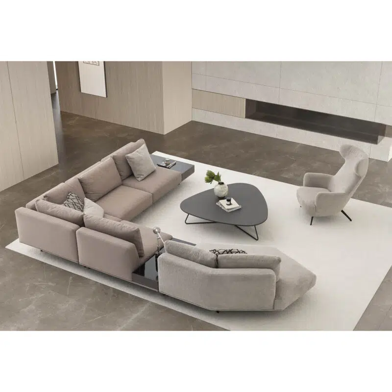 The Loft Modular Sofa in a modern living space with a off white rug and a minimalist coffee table