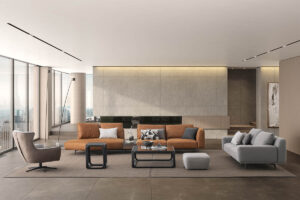 The Loft Modular Sofa in orange in a modern living space with a off white rug and a minimalist coffee table