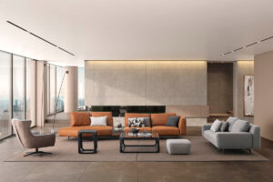 The Loft Modular Sofa in orange in a modern living space with a off white rug and a minimalist coffee table