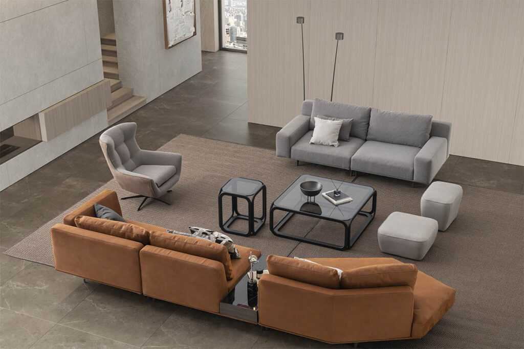 Modern living room with luxury leather and fabric sofas by LEOPARD Furniture, Canada. Sleek industrial interior design.
