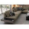 The Loft Modular Sofa in a modern living space with a green accent fabric and a black marble coffee table