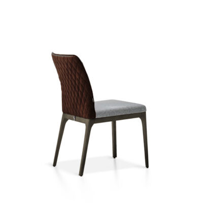 A white background image of the Toronto Dining Chair, showcasing its modern design and customizable upholstery options.