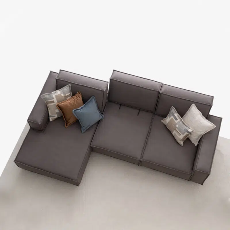 Luxurious sectional gray sofa with cushions on a white background, perfect for modern interiors at LEOPARD Furniture Canada.