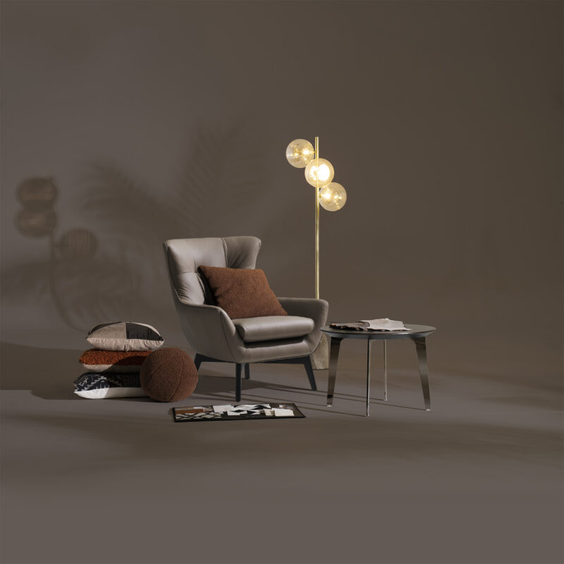 maserati leather armchair overall view with a beautiful floor lamp artistic design
