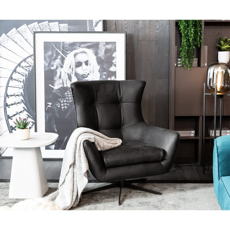 maserati swivel black leather accent armchair in a designed living room