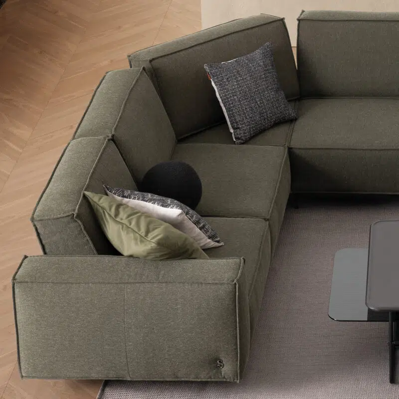 Modern green sectional sofa in a chic interior setup by LEOPARD Furniture, Canada’s top luxury interior designer.