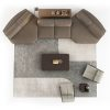 Top view of LEOPARD Furniture's modern sectional sofa and coffee table set on a geometric rug in a luxurious living room.