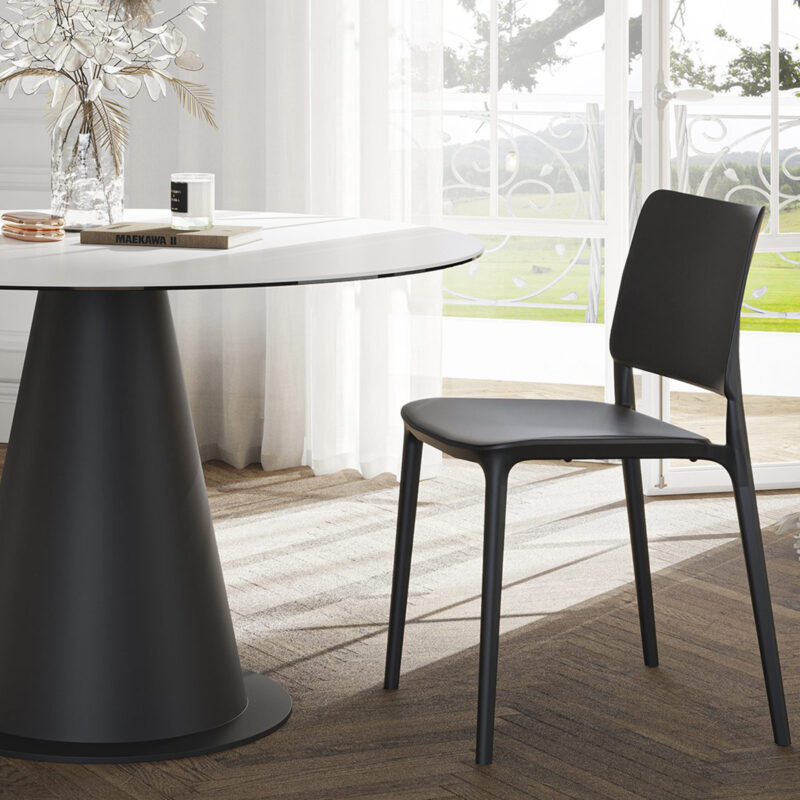 round white ceramic dining table minimalist and contemporary with a high end plastic chair