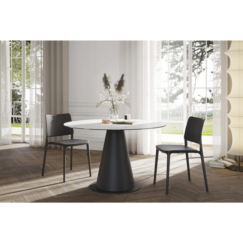 round white ceramic dining table minimalist and contemporary with high end plastic chairs