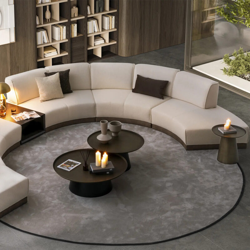 scandinavian living room design with curved modular sofa and round coffee table set