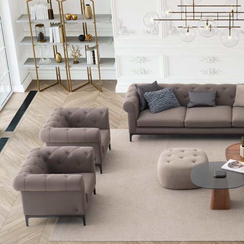 classic living room with chesterfield sofa and armchairs