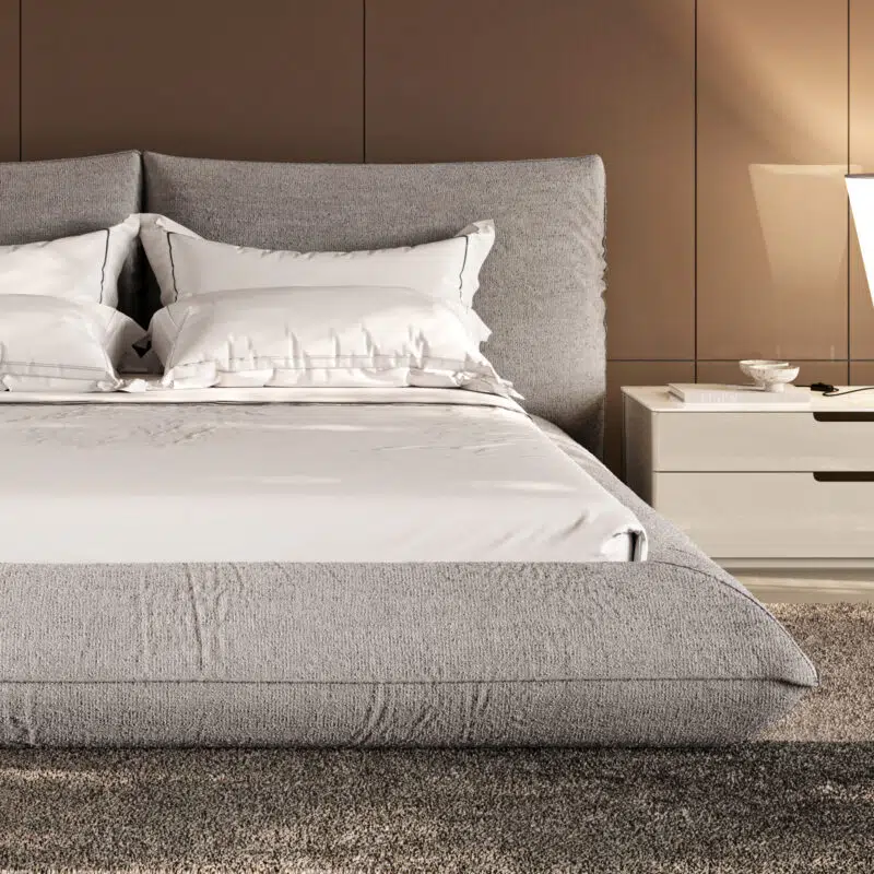 contemporary upholstered bed in light gray fabric detailed view in a well designed bedroom