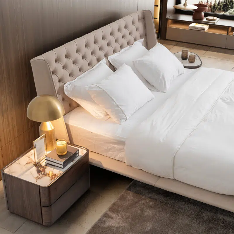 Luxurious contemporary bedroom setup featuring LEOPARD Furniture's tufted bed and elegant bedside table.