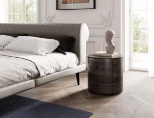 beautiful round nightstand black stone top in a bright bedroom