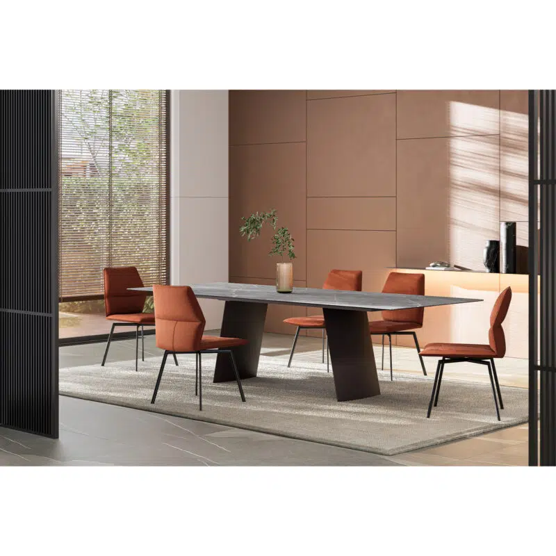 Modern dining room with sleek marble table and stylish orange chairs by LEOPARD Furniture; elegant interior design.