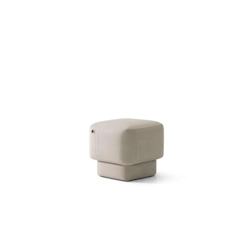 A beige cube ottoman by LEOPARD Furniture on white background. Perfect for modern luxury interiors in Canada.