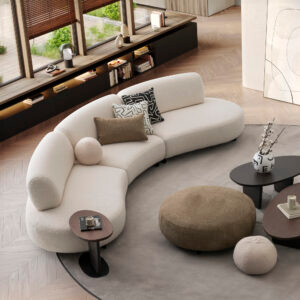Luxurious white curved sectional by LEOPARD Furniture in a modern living room with stylish decor and large windows.