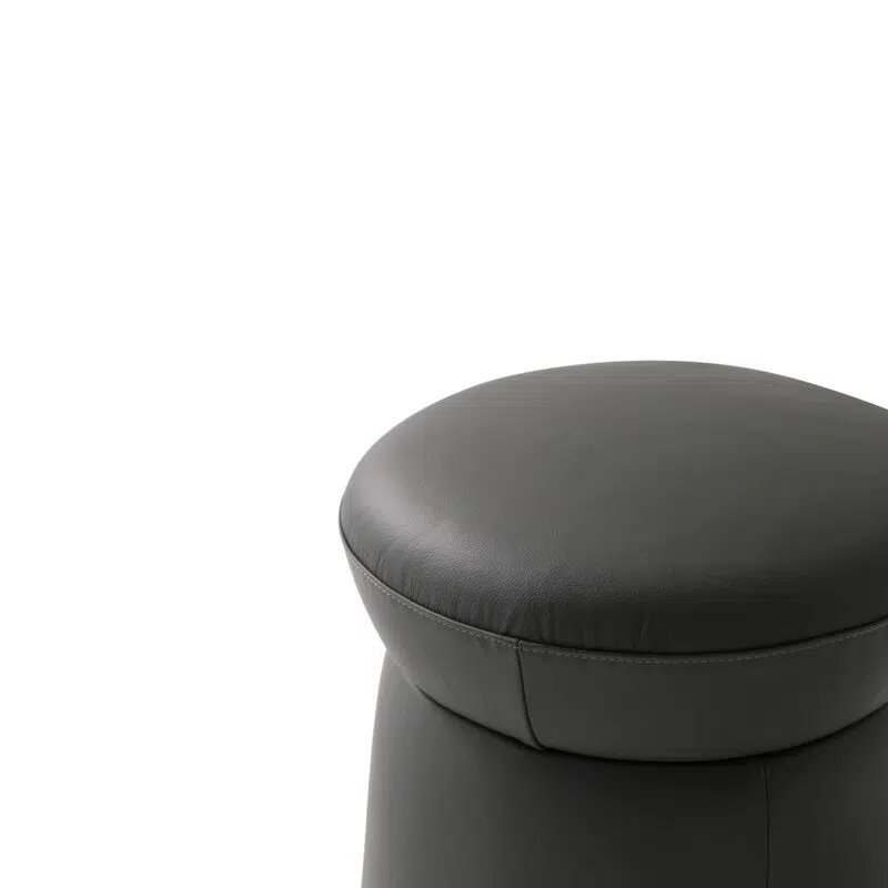 Luxury leather ottoman on white background by LEOPARD Furniture, Canada. High-end seating, modern design.