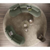 Elegant circular sectional sofa setup with round rug and coffee tables in contemporary design by LEOPARD Furniture Canada.