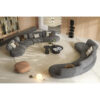 Curved modular gray sectional sofa in a modern living room by LEOPARD Furniture, Canada.