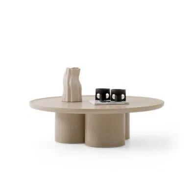 Modern beige round coffee table with sculptural base on white background, designed by LEOPARD Furniture, high-end style.