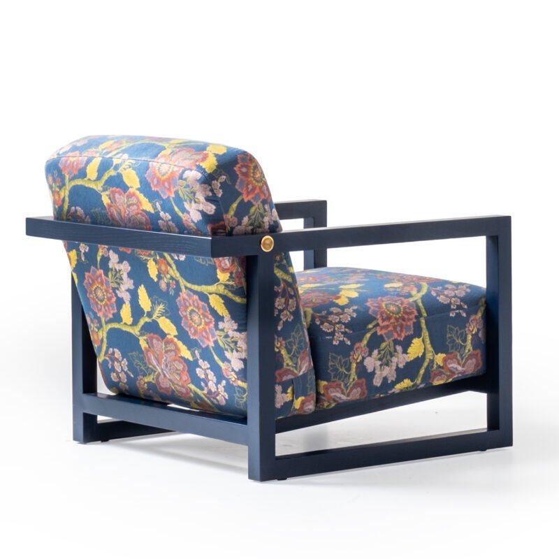 Colorful floral-patterned armchair with modern frame on white background by LEOPARD Furniture, high-end Canadian design.