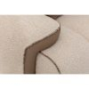 Luxurious beige boucle and leather armchair detail, showcasing LEOPARD Furniture's exquisite craftsmanship. White background.