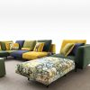 High-end sectional velvet sofa with colorful cushions, modern design by LEOPARD Furniture, on a white background.