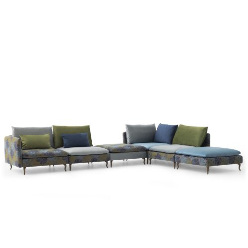 Luxurious sectional sofa with floral upholstery and colorful cushions, on a white background, from LEOPARD Furniture, Canada.