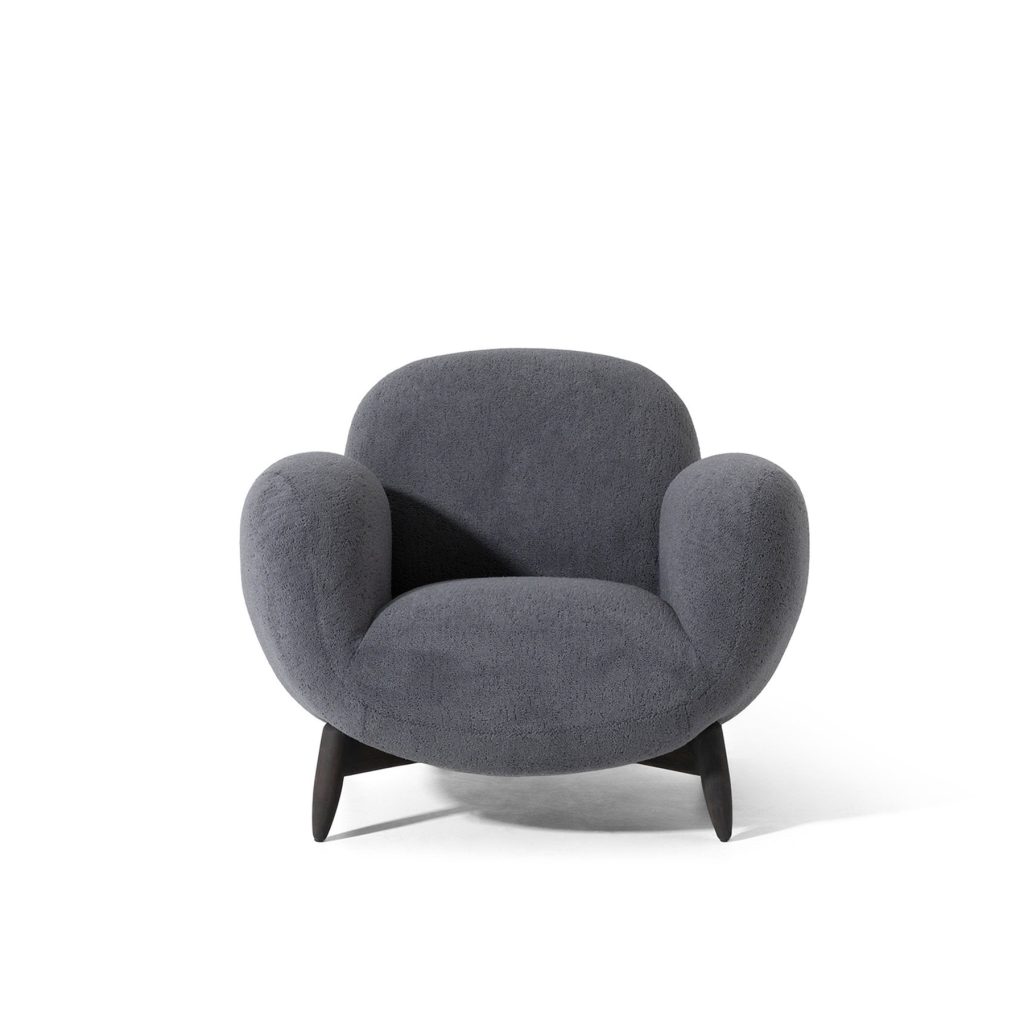 Modern dark gray boucle armchair from LEOPARD Furniture on a white background, perfect for luxury Canadian interiors.