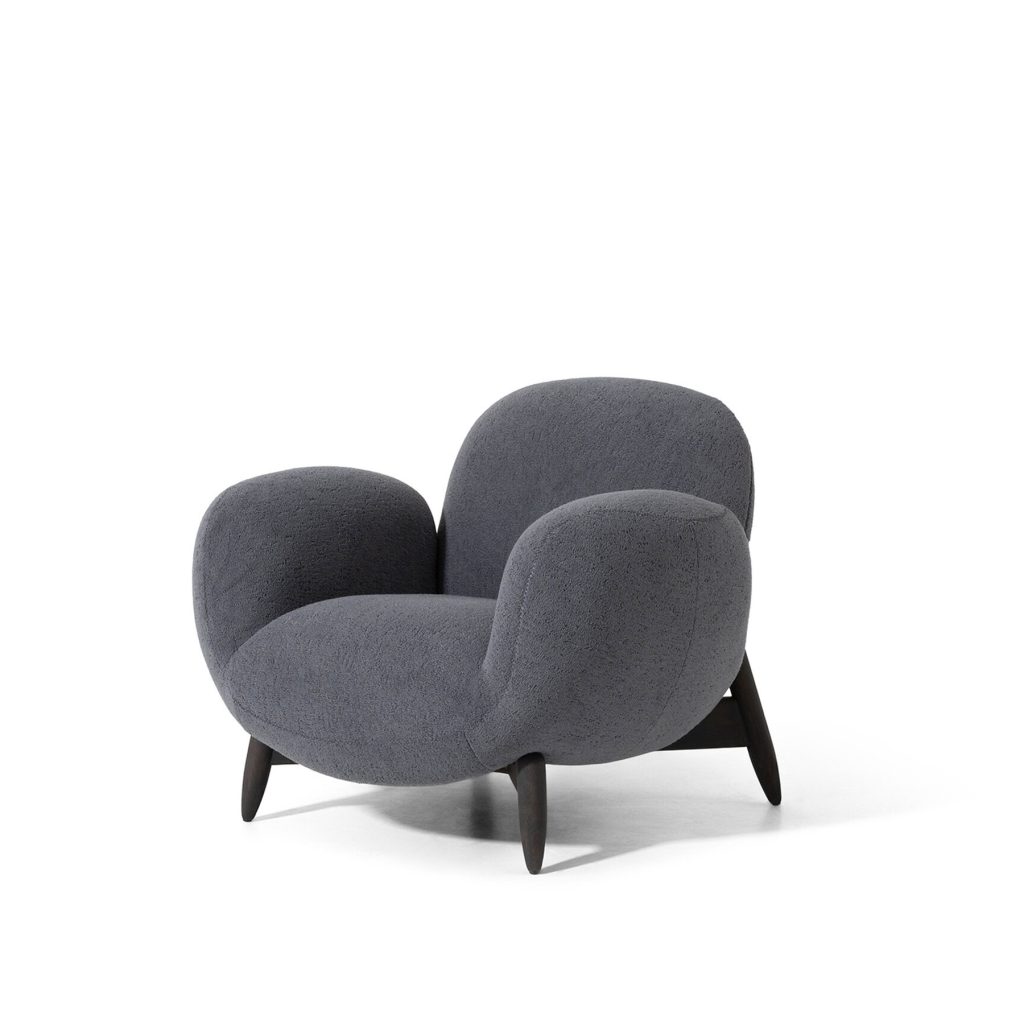 Luxurious grey armchair by LEOPARD Furniture on white background, showcasing contemporary design elegance.