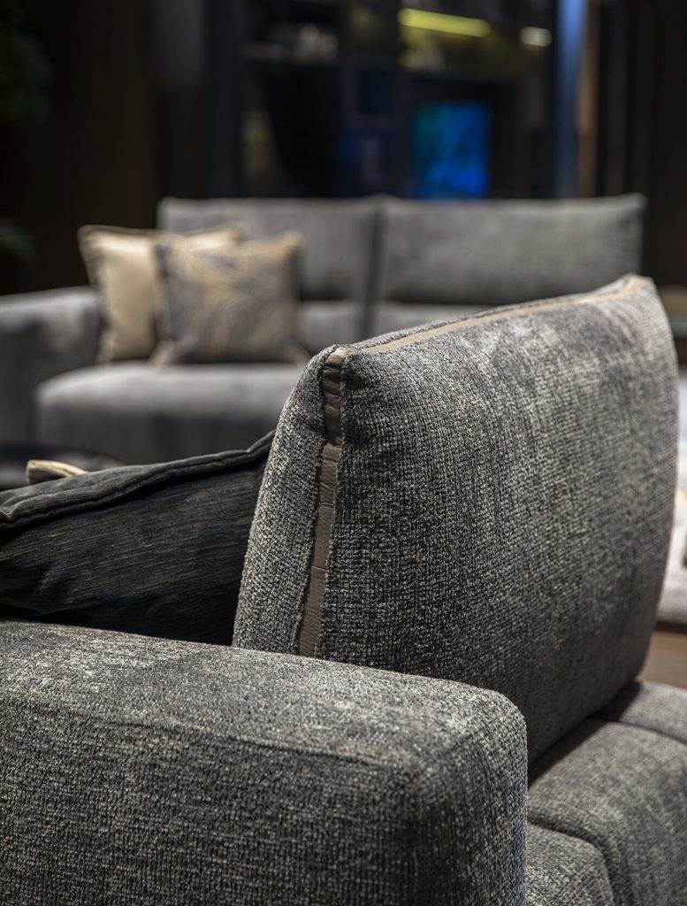 Elegant gray textured sectional sofa in modern interior by LEOPARD Furniture, Canada's premium designer.