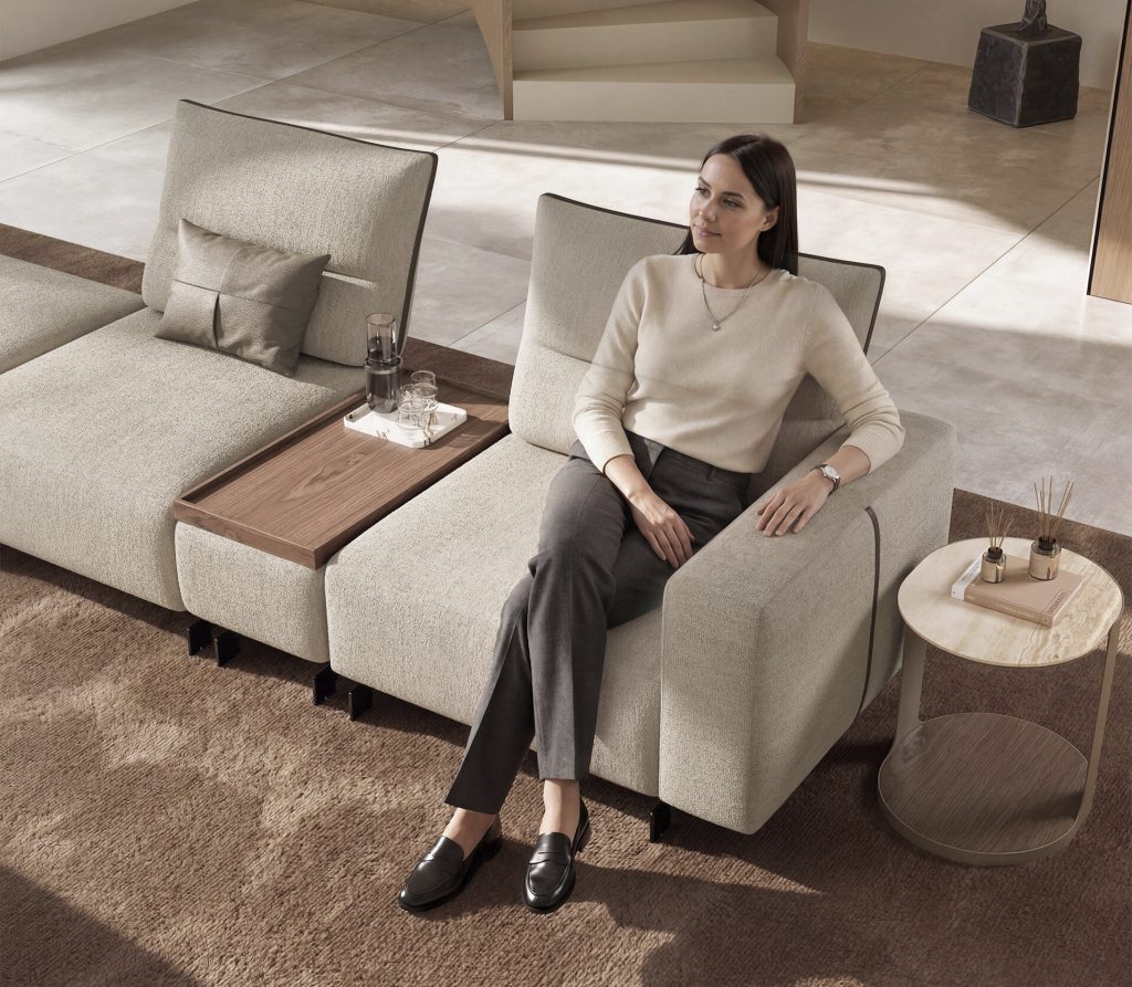 Modern beige modular sofa in a cozy, minimalist living room setting by LEOPARD Furniture Canada.