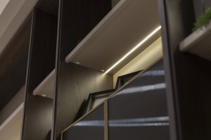 Modern shelving with integrated LED lighting by LEOPARD Furniture, showcasing elegant, minimalist design.