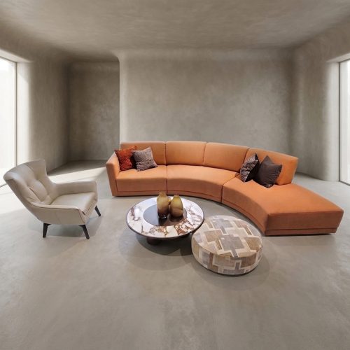 Modern curved sofa with beige armchair in minimalist living room by LEOPARD Furniture, Canada.