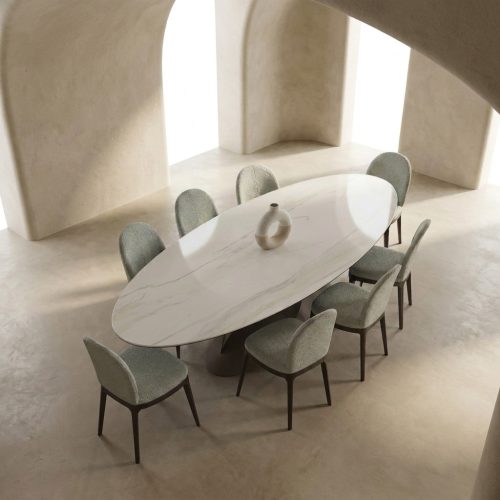 Salle à manger moderne avec table ovale en marbre et chaises élégantes de LEOPARD Furniture, style minimaliste.