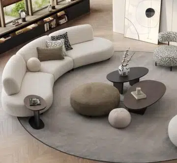 montreal premium living room setup with the round modular sofa named bon bon in white fabric upholstery and bonbon accent chair. and big round ottoman in green fabric beside barcelona coffee table set