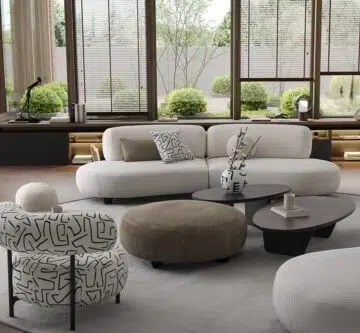 montreal premium living room setup with the round modular sofa named bon bon in white fabric upholstery and bonbon accent chair. and big round ottoman in green fabric beside barcelona coffee table set